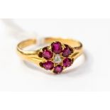 An ruby and diamond 18ct gold ring,