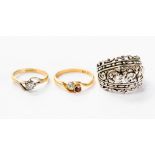 A solitaire diamond ring in 18ct gold and another dress ring; together with a silver ring, 0.