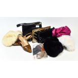 A collection of hats to include, a French navy sheepskin hat by Kendal Milne, a cream sheepskin hat,