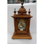 Oak cased eight day mantle clock, with gilt metal decoration around the dial,