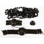 A collection of Whitby Jet, bracelets,