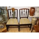 A set of four George III mahogany side chairs, circa 1800, in the manner of Thomas Sheraton,