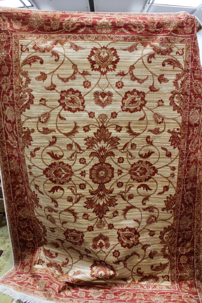 A Ziegler beige ground carpet,