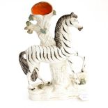 A Staffordshire zebra spill vase