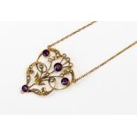 An Edwardian gold stamped pendant, set with four round amethyst, inc.