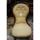 A mid Victorian walnut buttoned back nursing chair