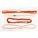 A five strand coral bead necklace, a woven coral bead necklace,