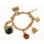 A Rose gold fob bracelet with various Carnelian and bloodstone fobs and a tassel,