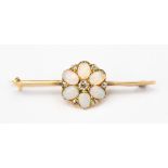 A high carat gold (probably 18ct) opal and diamond bar brooch, with a flower detail to the centre,