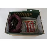 An unsorted collection of cigarette cards and cigarette packets,