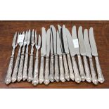 A set of twelve dessert knives and six silver dessert forks, Sheffield 1973, combined weight 12.