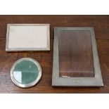 Three silver picture frames,