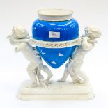 Minton centerpiece vase being carried by two putti,