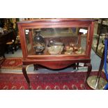 An early 20th century mahogany vitrine fitted with a single drawer