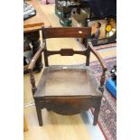 A George IV mahogany commode chair,