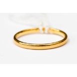 A 22ct gold wedding band, size M,