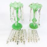 A pair of opaque green glass lustre vases with cut glass droplets,