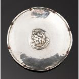 Omar Ramsden, an Arts and Crafts silver dish, pinched border with garnet type cabouchons,