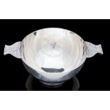 Glasgow School, a Celtic Arts and Crafts silver quaich, in the Iona style, plain hemispherical,