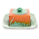 A Shelley Harmony butter dish and cover, turquoise ground with orange radiating spray pattern late,