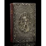 An Arts and Crafts silver covered Book of Common Prayer,