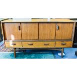 A G Plan teak sideboard, 1950s, hinged sliding doors above three low drawers,