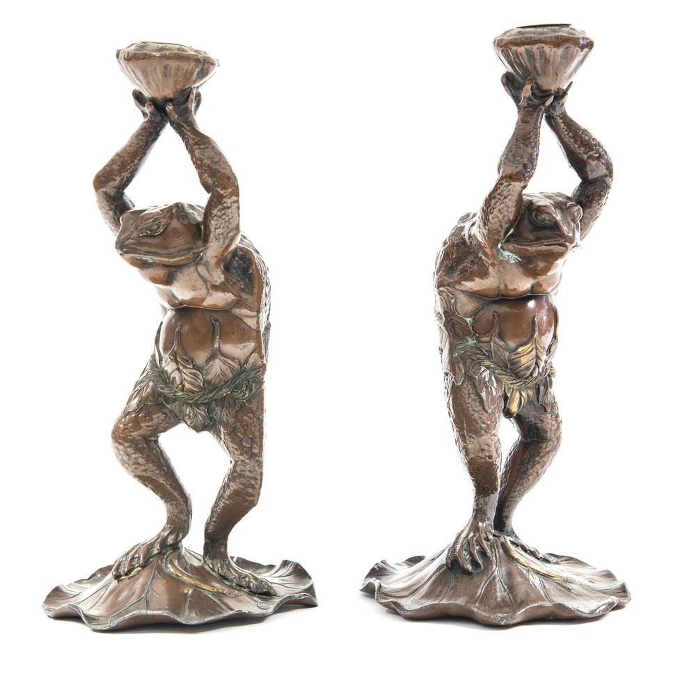 A pair of Aesthetic Movement bronzed toad candlesticks, each modelled realistically,