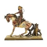 An Art Deco cold painted figural table lighter in the form of a Cowboy on Horse