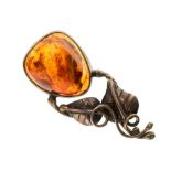 A Polish silver and amber stylised floral brooch,
