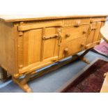 Rupert Griffiths, an Arts and Crafts, Cotswold School, carved oak sideboard,