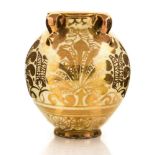 An Arts and Crafts style lustre vase, in the Moorish tradition, ovoid form with four loop handles,