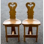 Rupert Griffiths, an Arts and Crafts, Cotswold School, a set of six carved oak dining chairs,