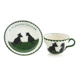 Louis Wain for Bristol pottery, a Cat and Dog tea cup and saucer,