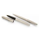 A Parker Harlequin stainless steel fountain pen with 14ct gold nib and a ballpoint pen (2)