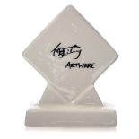 A Lorna Bailey Artware advertising plaque, diamond form, plain white,