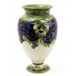 William Moorcroft, a large Pansy vase, footed ovoid form with flared neck, white ground,