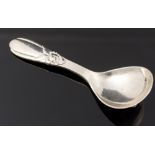 Evald Nielsen, a Danish silver cady spoon, 1927, hand hammered with stylised floral motif, 10.