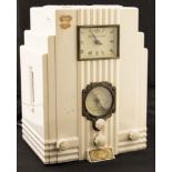 An Art Deco style 'Spirit of St Louis' radio, white plastic, stepped and fluted design, with clock,