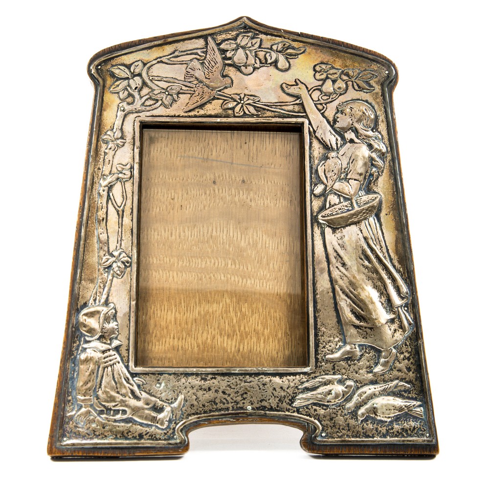 An Arts and Crafts silver embossed picture frame, in the Art Nouveau style,