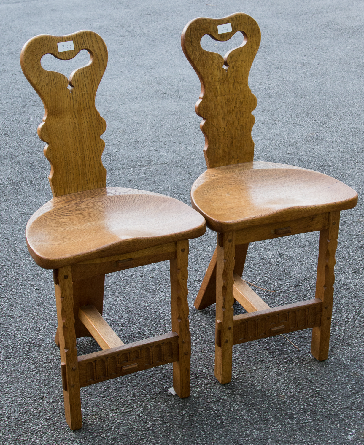 Rupert Griffiths, an Arts and Crafts, Cotswold School, a set of six carved oak dining chairs, - Image 2 of 2