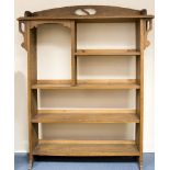 An Arts and Crafts oak bookshelf with four shelves, 99cm wide, 122cm high,