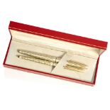 Sheaffer Lady fountain pen and ballpoint, brushed steel with gold incised fishscale,