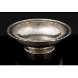 Omar Ramsden, an Arts and Crafts silver bowl with hammered finish, raised on circular pedestal foot,