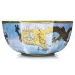 A Wedgwood lustre bowl octagonal form decorated with dragons and oriental scenes to the border,