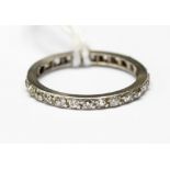 A diamond eternity ring, fully set with brilliant cut diamonds, finger size L,