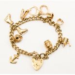 A nine carat gold charm bracelet with eleven gold charms,