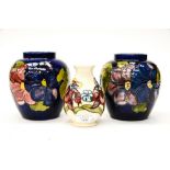 A Moorcroft Iris pattern on cream ground vase;