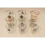 Glass whisky jugs including Nelson, Kensitas, Senior Service,