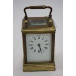 A brass carriage clock by R & Co,