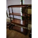 A Victorian four tier mahogany What Not, each section raised on turned supports,